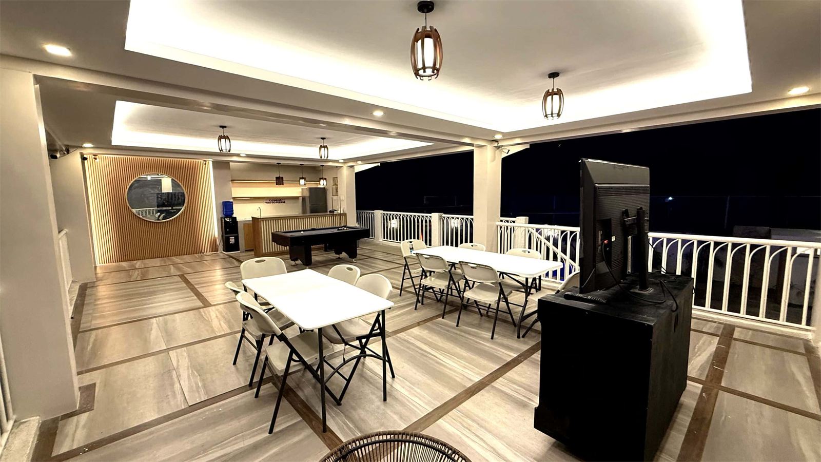 Function hall with dining tables, billiards and a videoke machine